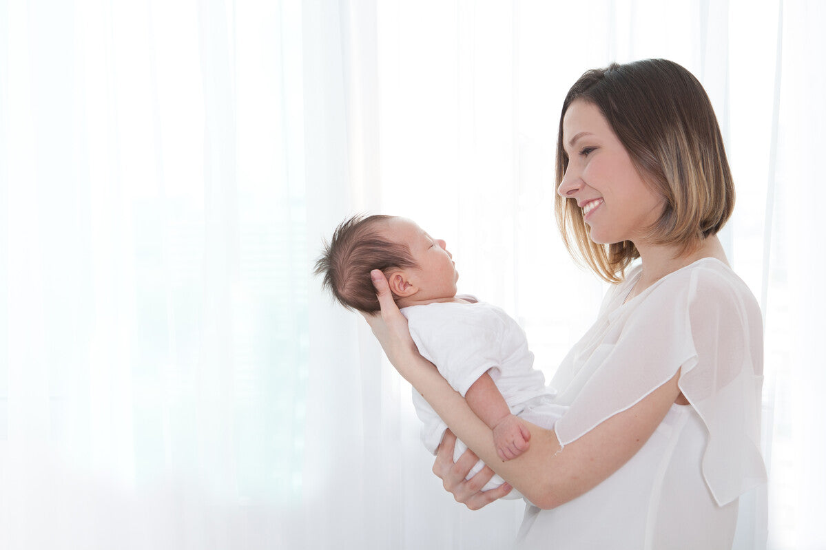 mother holding newborn