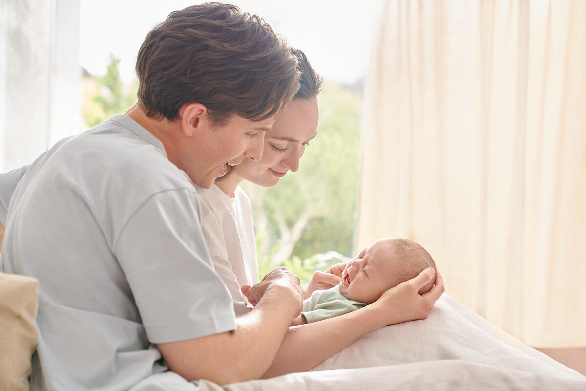 parents soothing baby with suspected colic