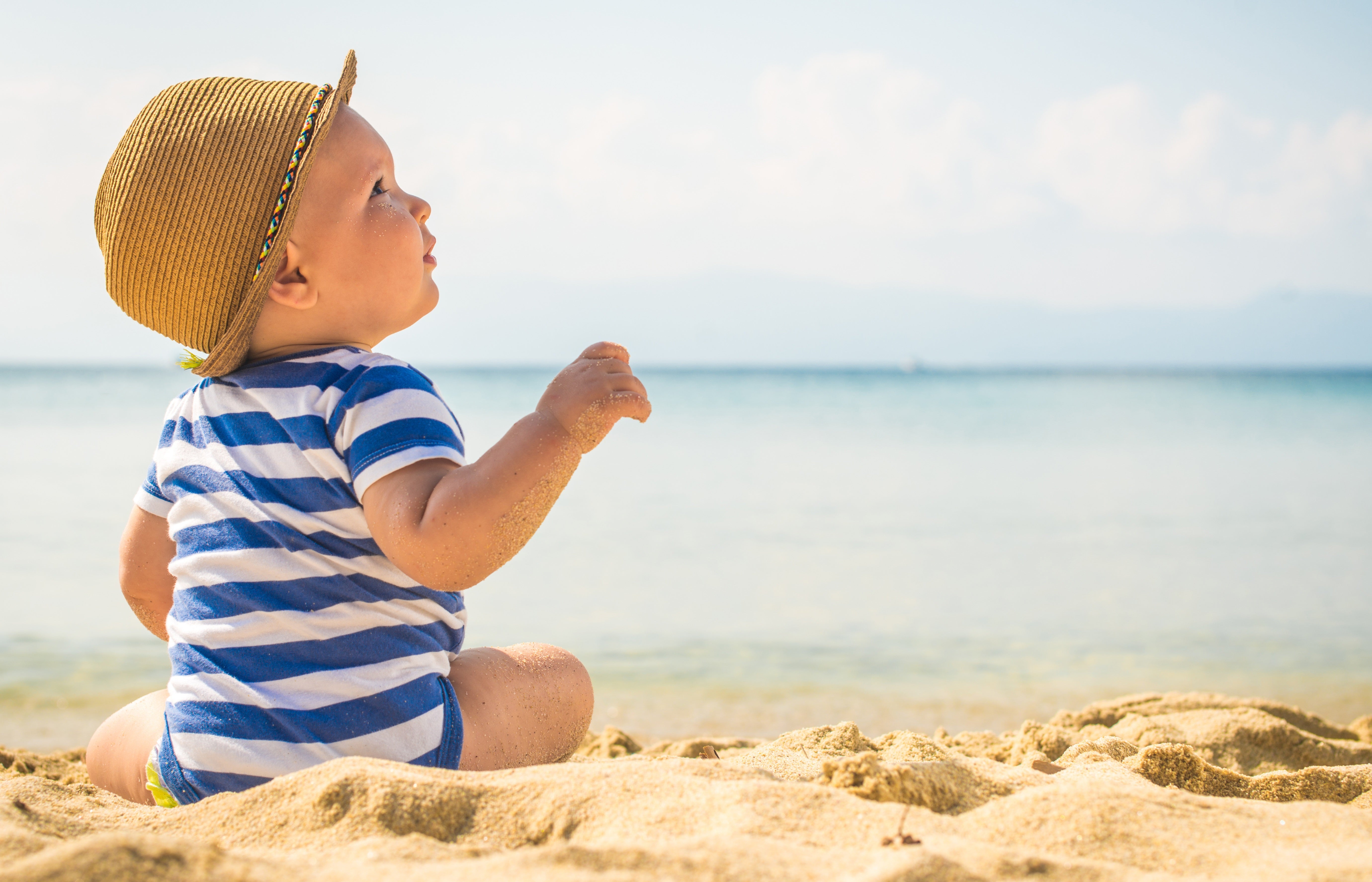 baby sitting by the beach 