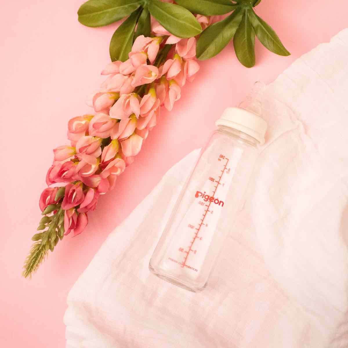 glass baby bottle with flower