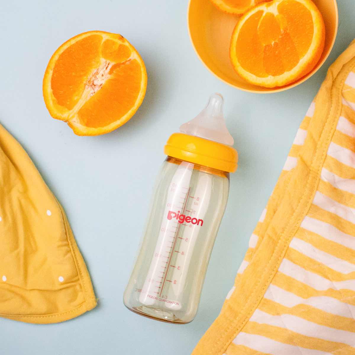 baby bottle with oranges